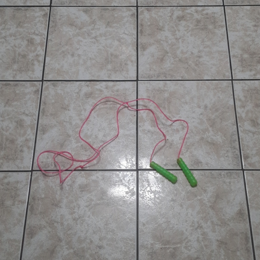 🍭 Pink and green plastic jump rope